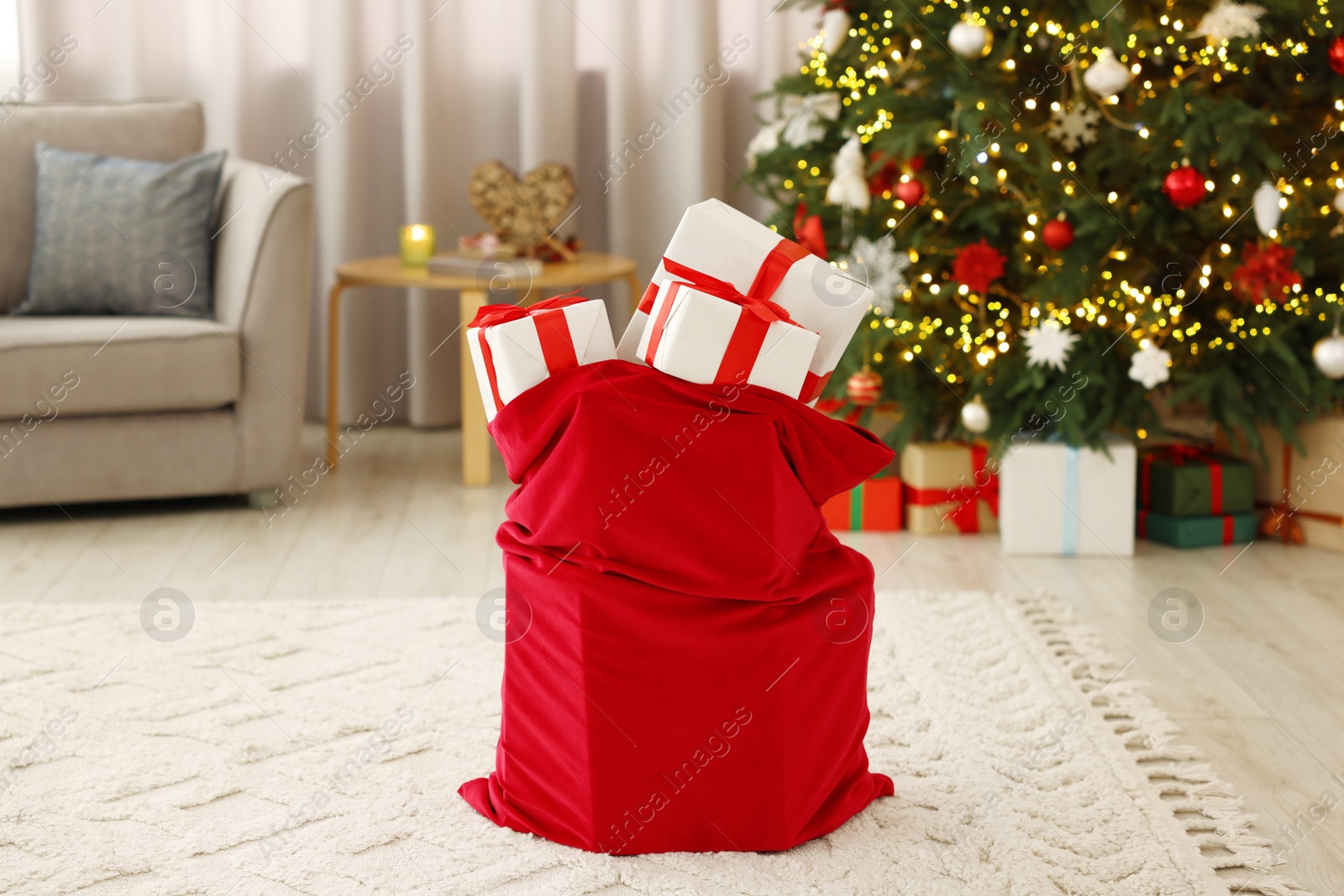 Photo of Santa bag full of Christmas presents at home