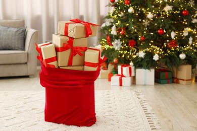 Photo of Santa bag full of Christmas presents at home