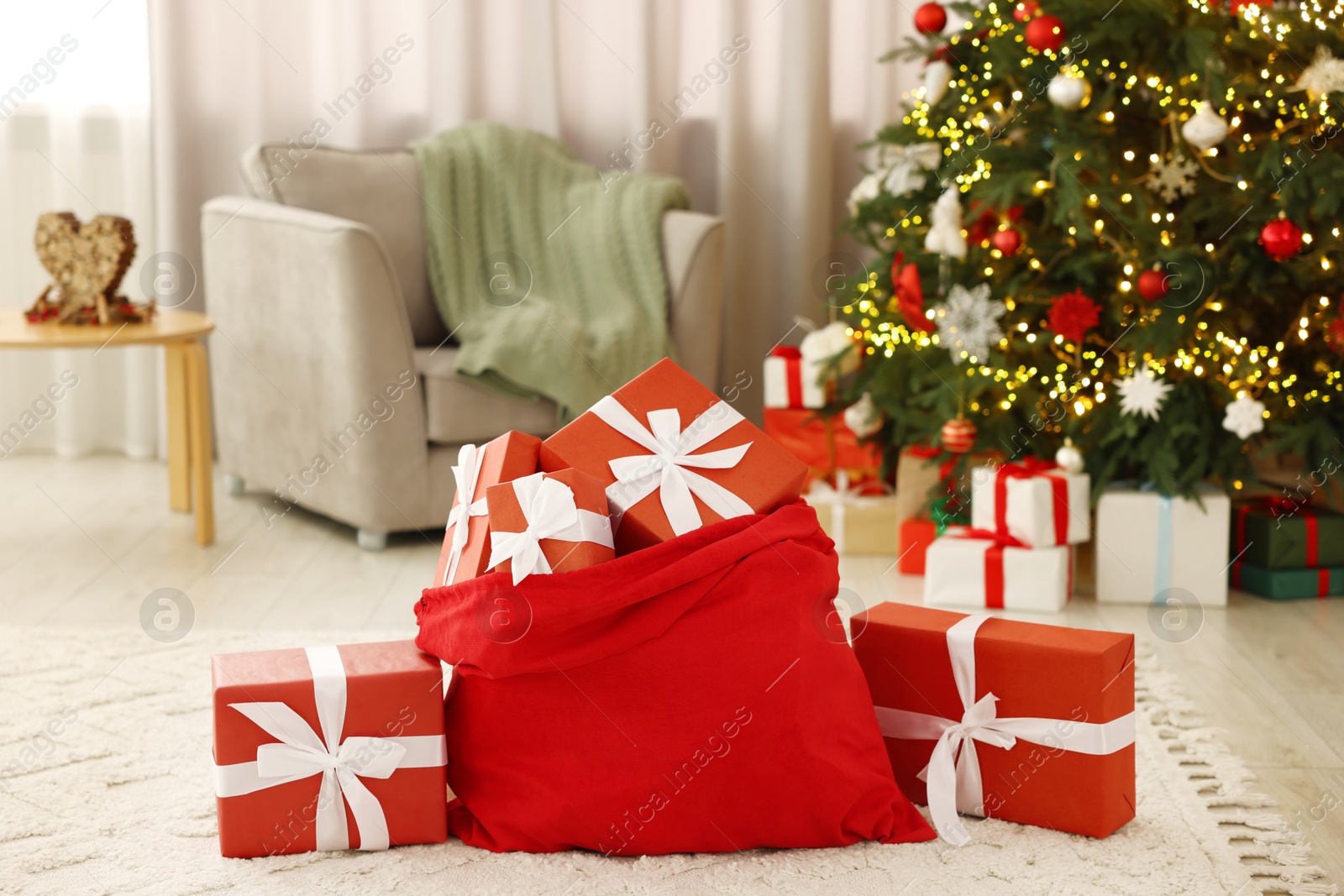 Photo of Santa bag full of Christmas presents at home