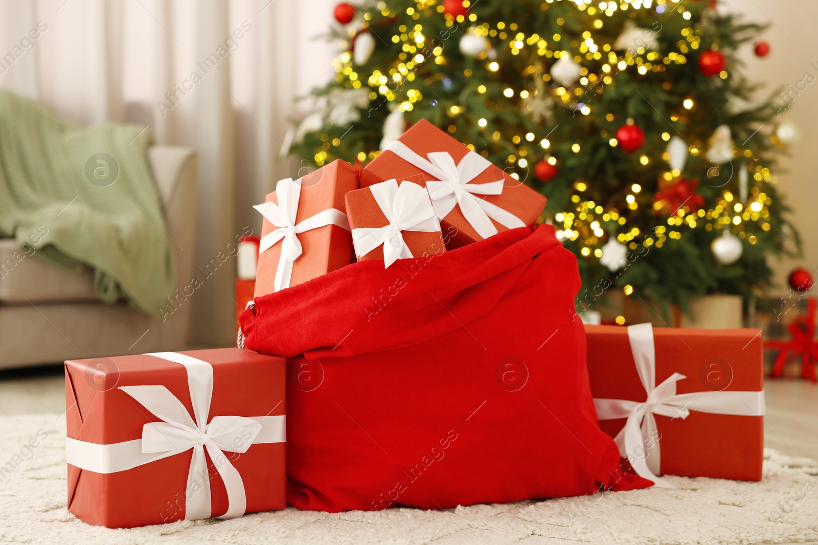 Photo of Santa bag full of Christmas presents at home