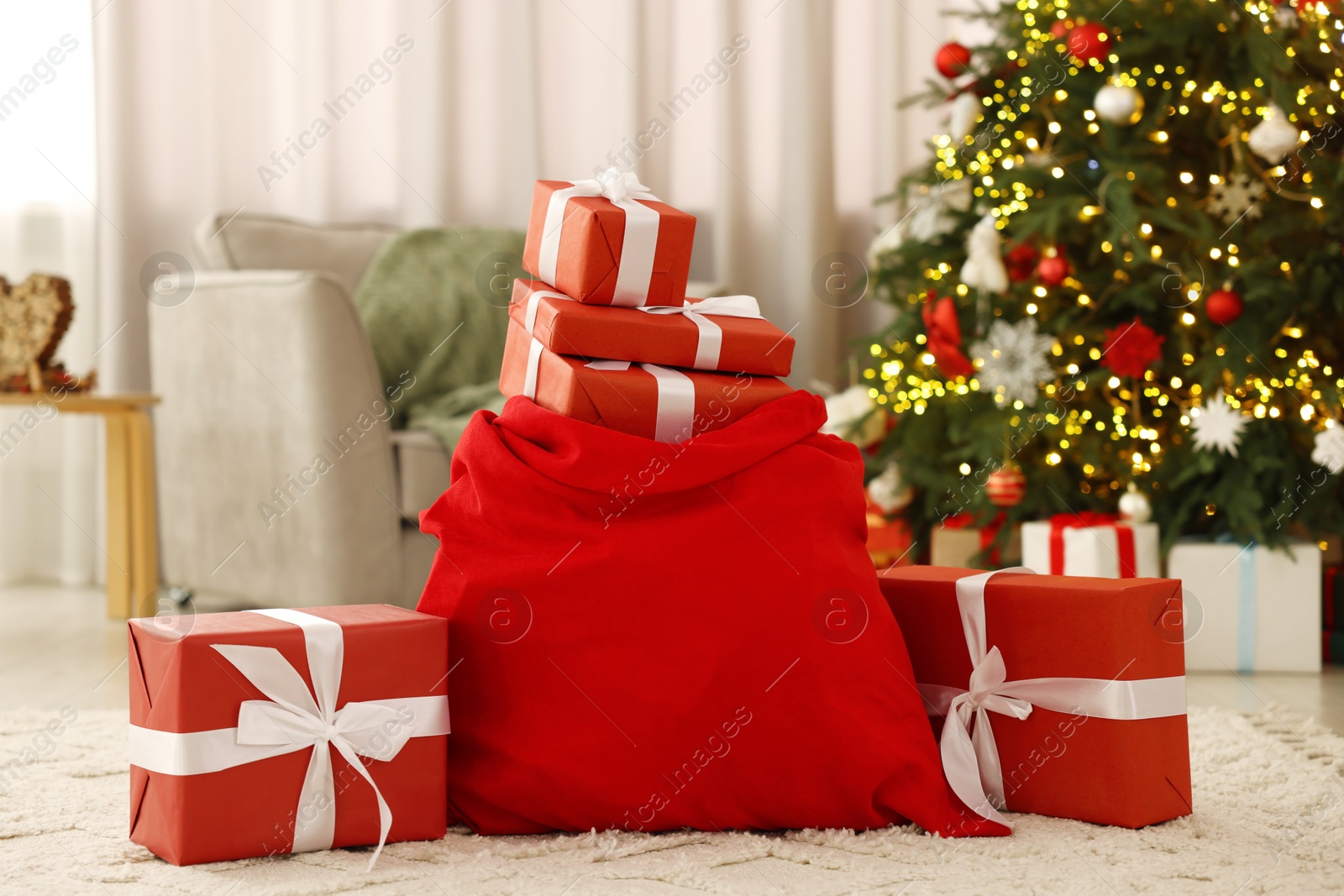 Photo of Santa bag full of Christmas presents at home