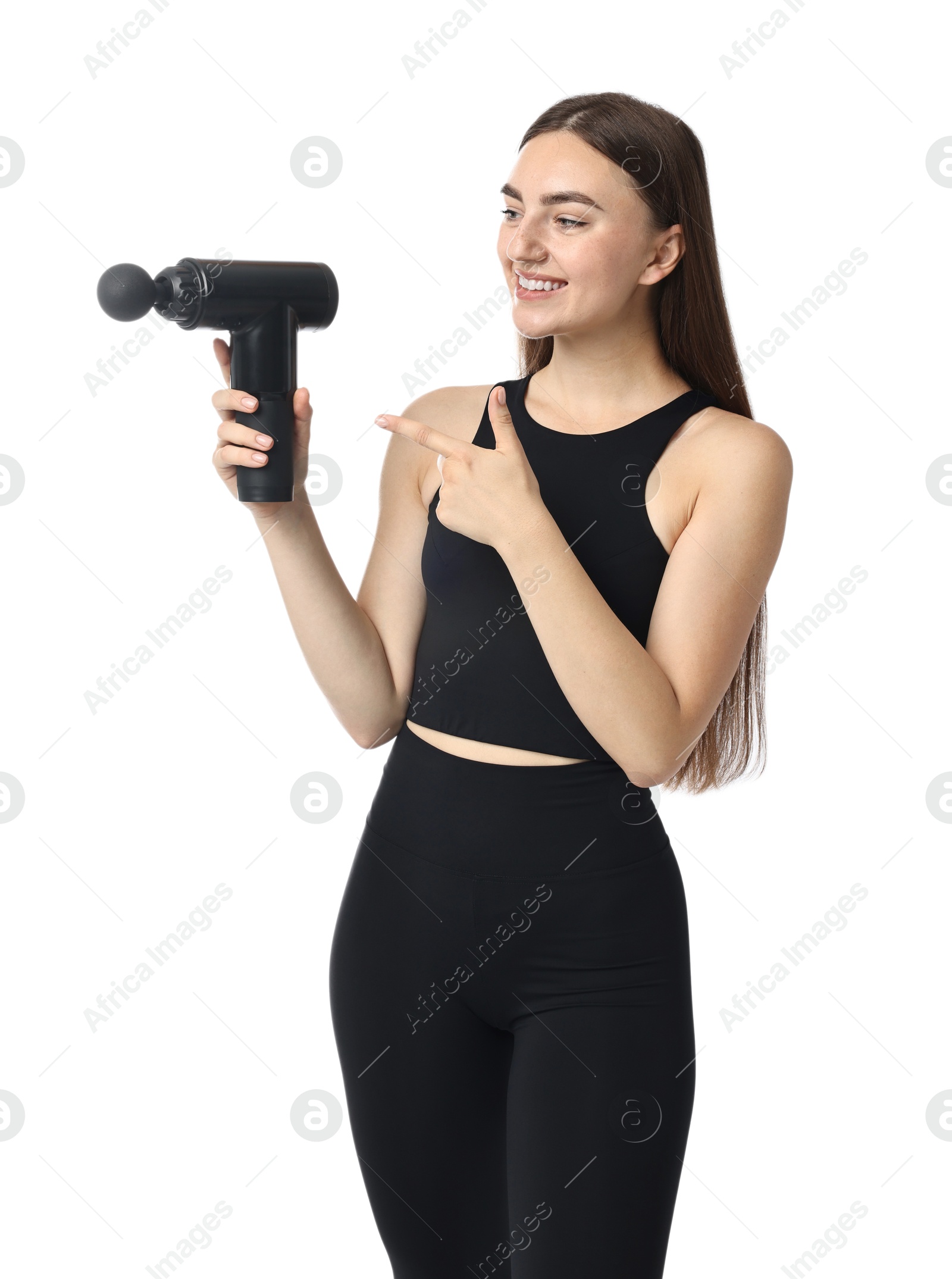 Photo of Young woman pointing at percussive massager on white background