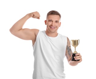 Happy winner with golden trophy cup showing his bicep on white background