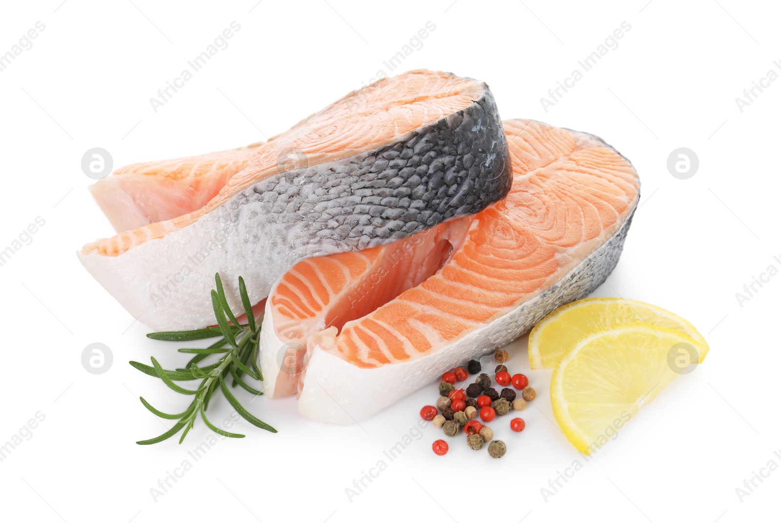 Photo of Steaks of fresh raw salmon and spices isolated on white