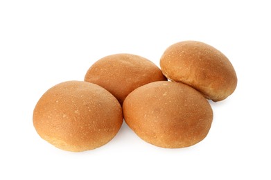 Photo of Many fresh tasty buns isolated on white