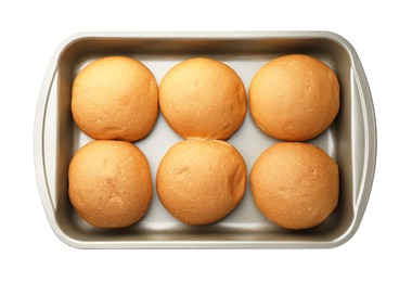 Photo of Fresh tasty buns in baking tray isolated on white, top view