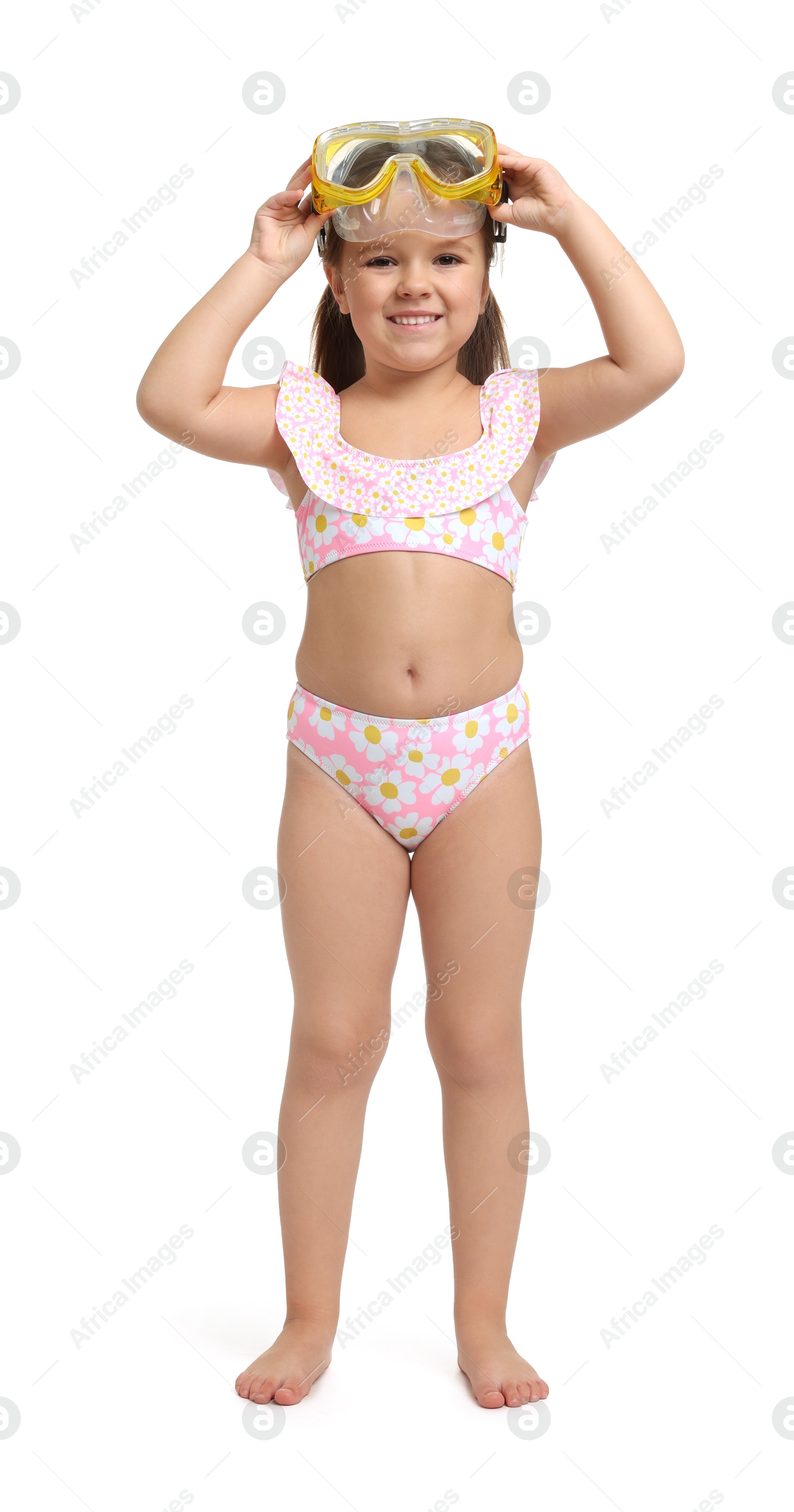 Photo of Cute little girl in swimsuit with mask on white background