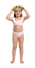 Photo of Cute little girl in swimsuit with mask on white background