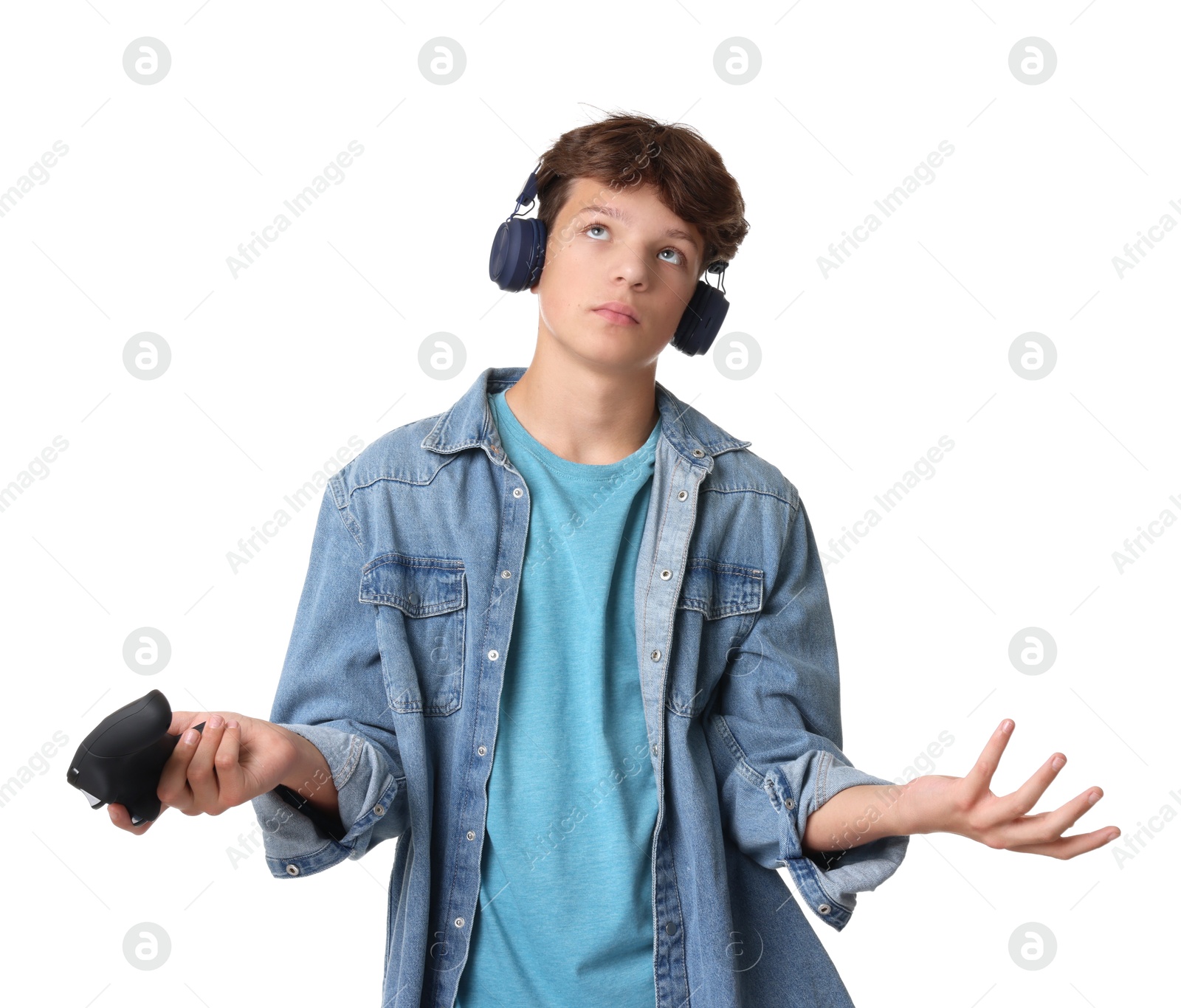 Photo of Teenage boy in headphones with controller on white background