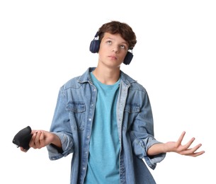 Teenage boy in headphones with controller on white background