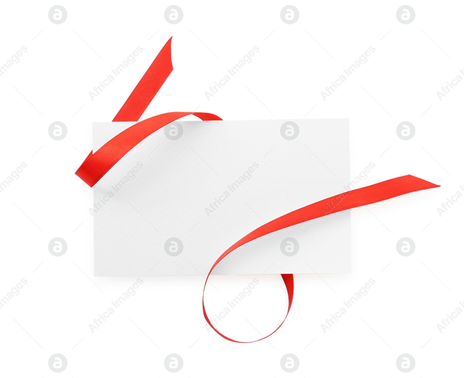 Photo of Blank card and red ribbon isolated on white, top view