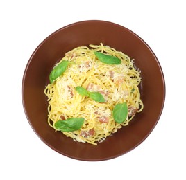 Photo of Delicious pasta Carbonara in bowl isolated on white, top view