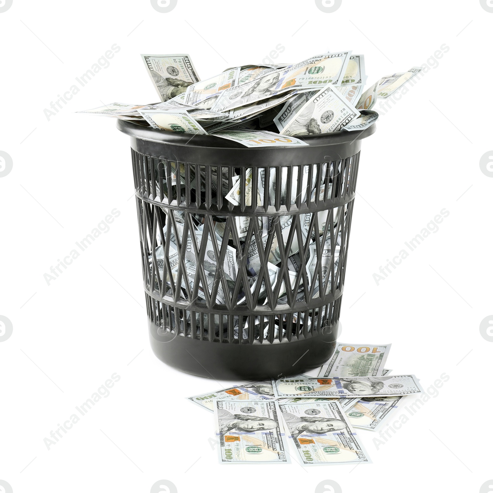 Photo of Many dollar banknotes in trash bin isolated on white