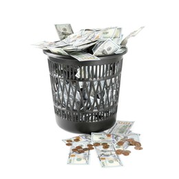 Photo of Many dollar banknotes in trash bin isolated on white