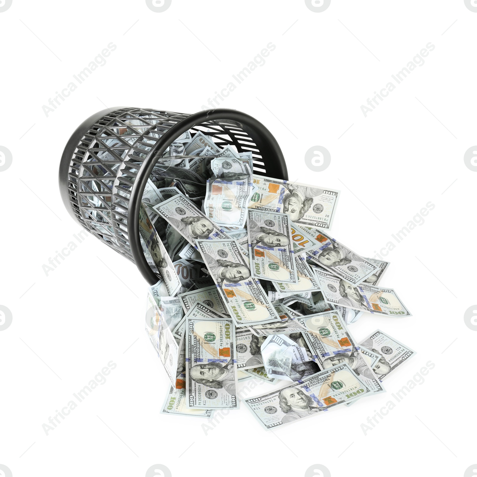 Photo of Many dollar banknotes and overturned trash bin isolated on white