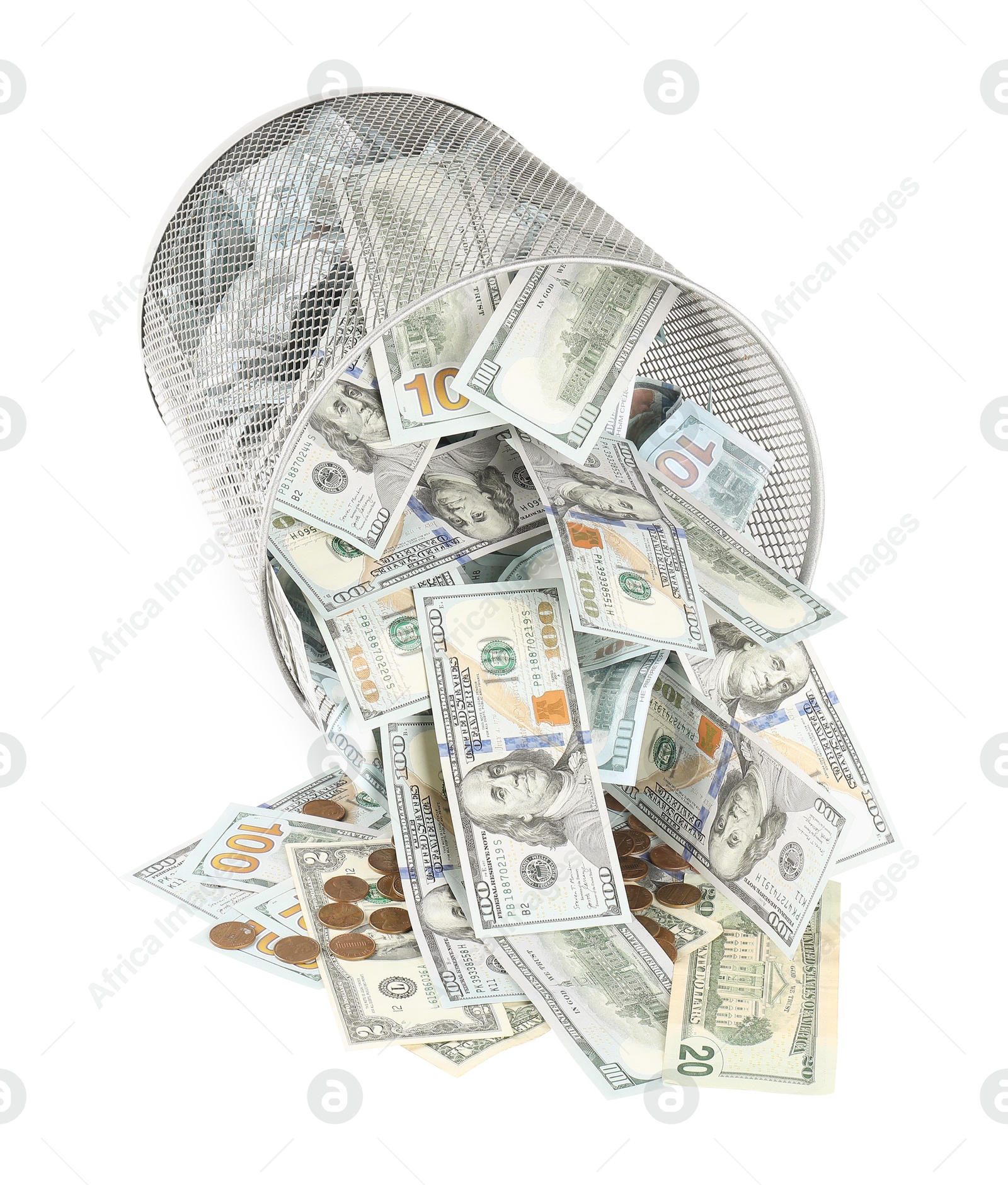 Photo of Many dollar banknotes, overturned trash bin and coins isolated on white