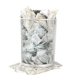 Photo of Many dollar banknotes in trash bin isolated on white