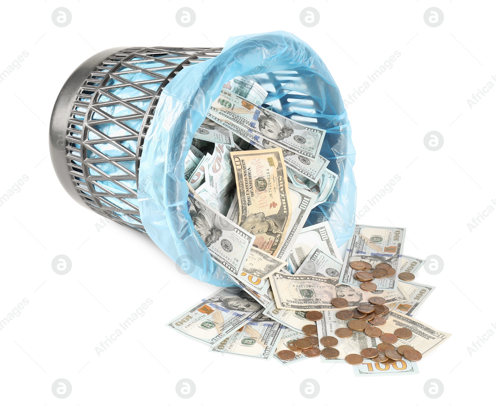 Photo of Many dollar banknotes, overturned trash bin and coins isolated on white