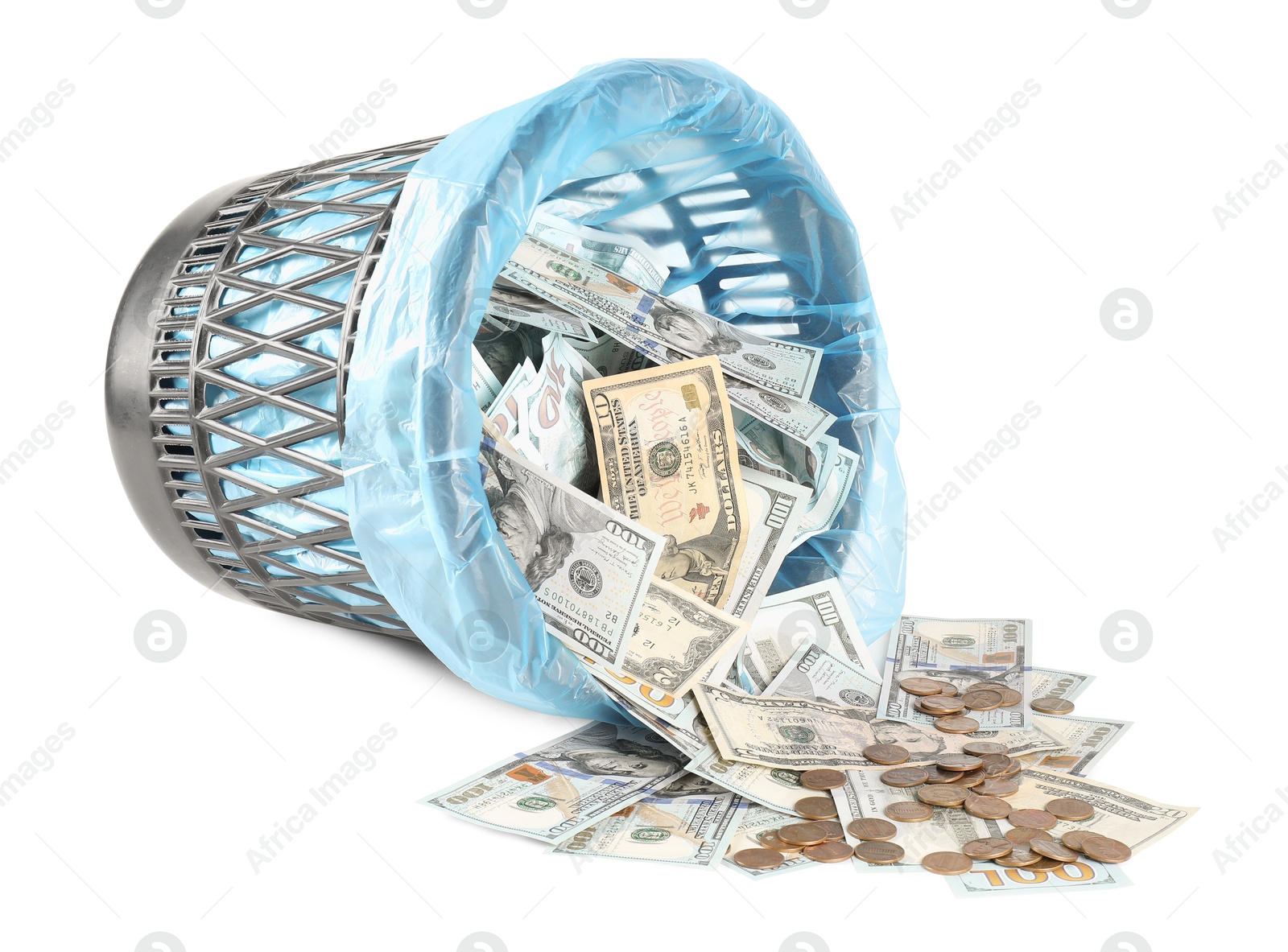 Photo of Many dollar banknotes, overturned trash bin and coins isolated on white