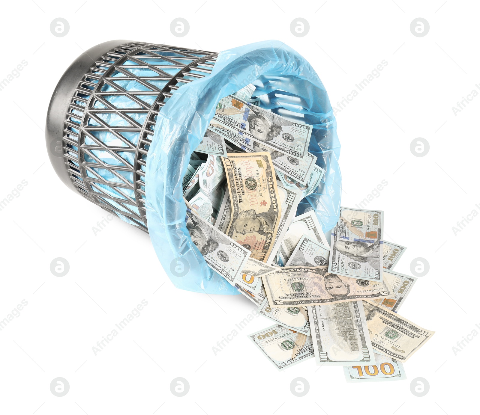 Photo of Many dollar banknotes and overturned trash bin isolated on white