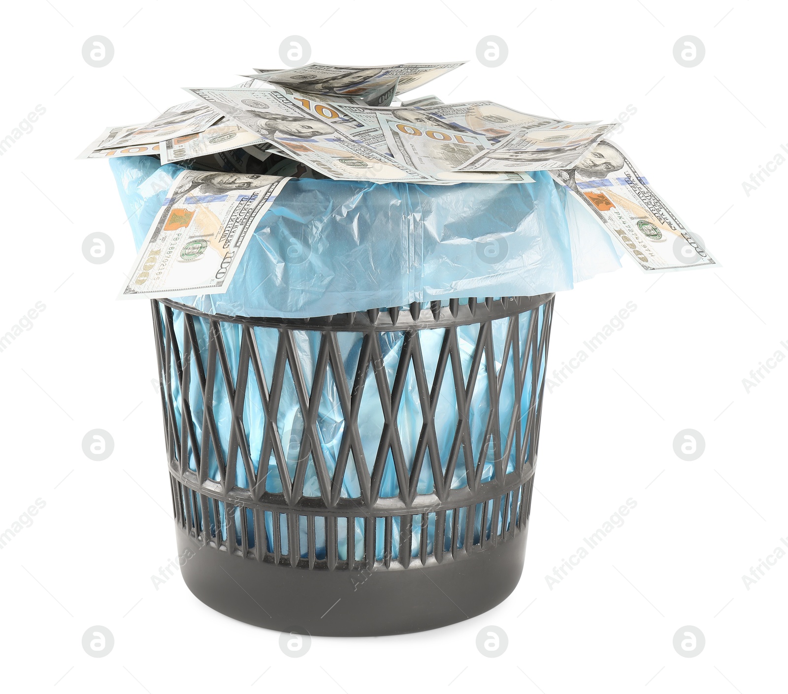 Photo of Many dollar banknotes in trash bin isolated on white