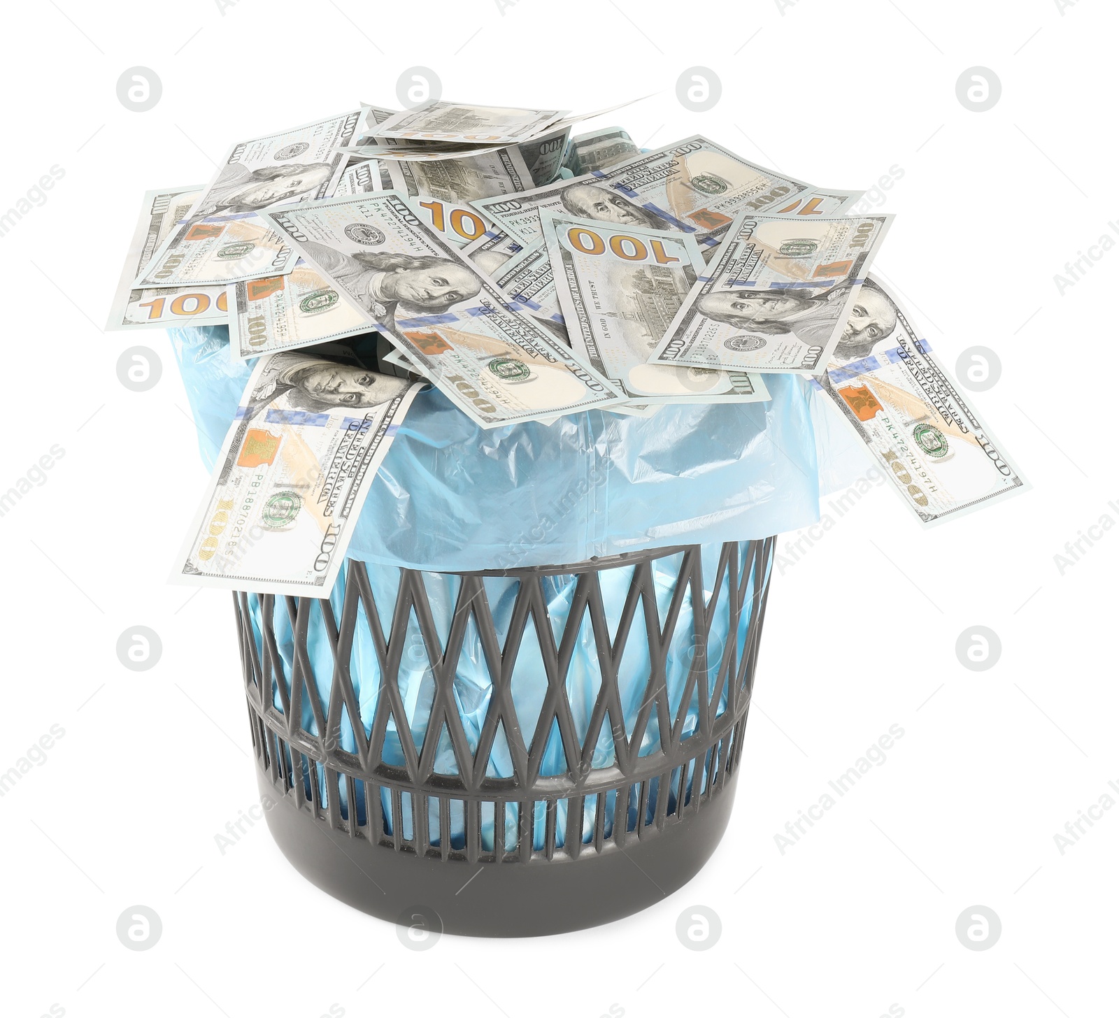 Photo of Many dollar banknotes in trash bin isolated on white