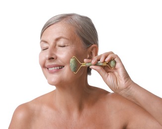 Photo of Beautiful woman doing facial massage with roller on white background