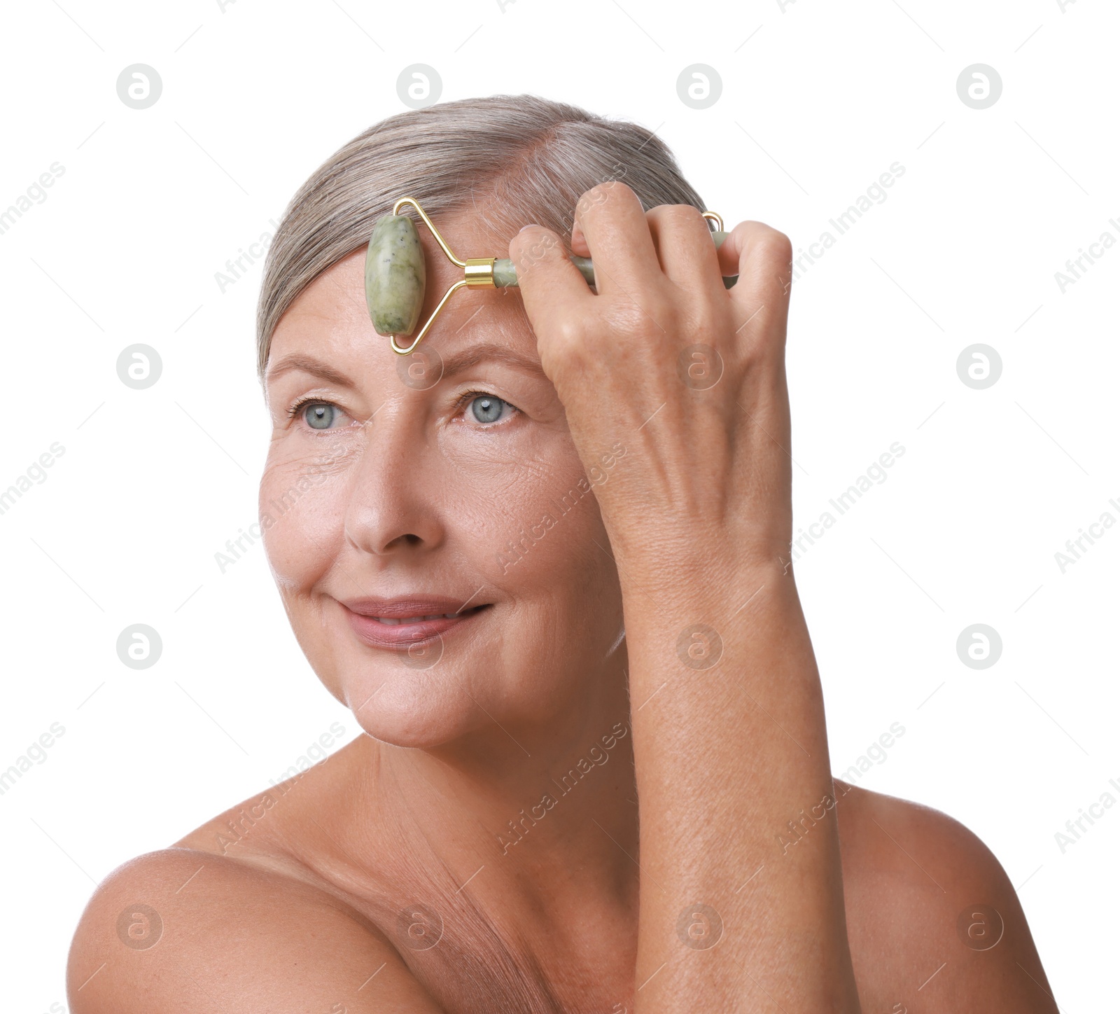 Photo of Beautiful woman doing facial massage with roller on white background