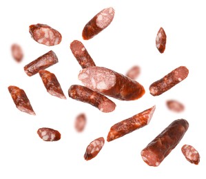 Image of Dry smoked sausage pieces in air on white background, collage