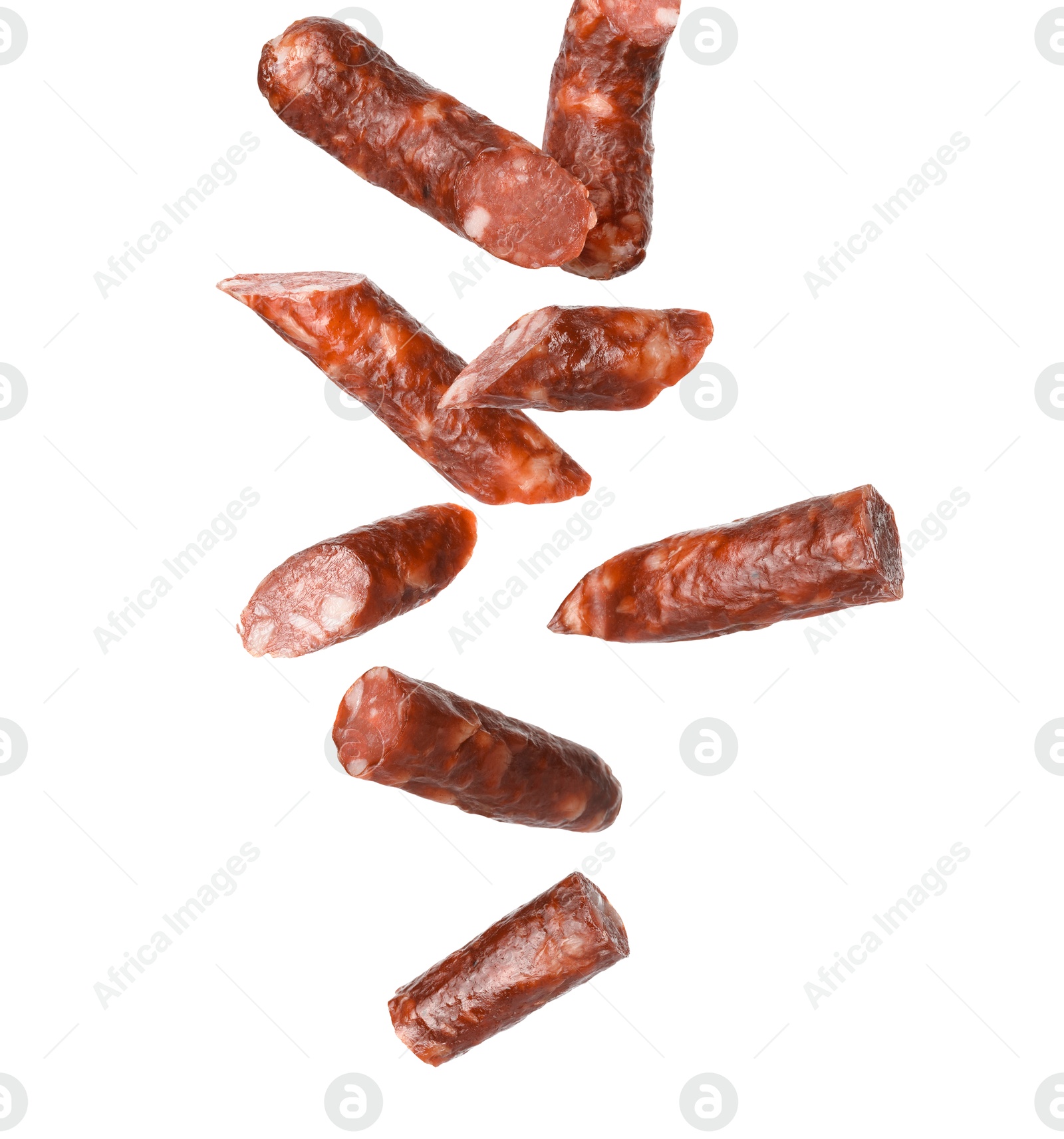 Image of Dry smoked sausage pieces in air on white background, collage