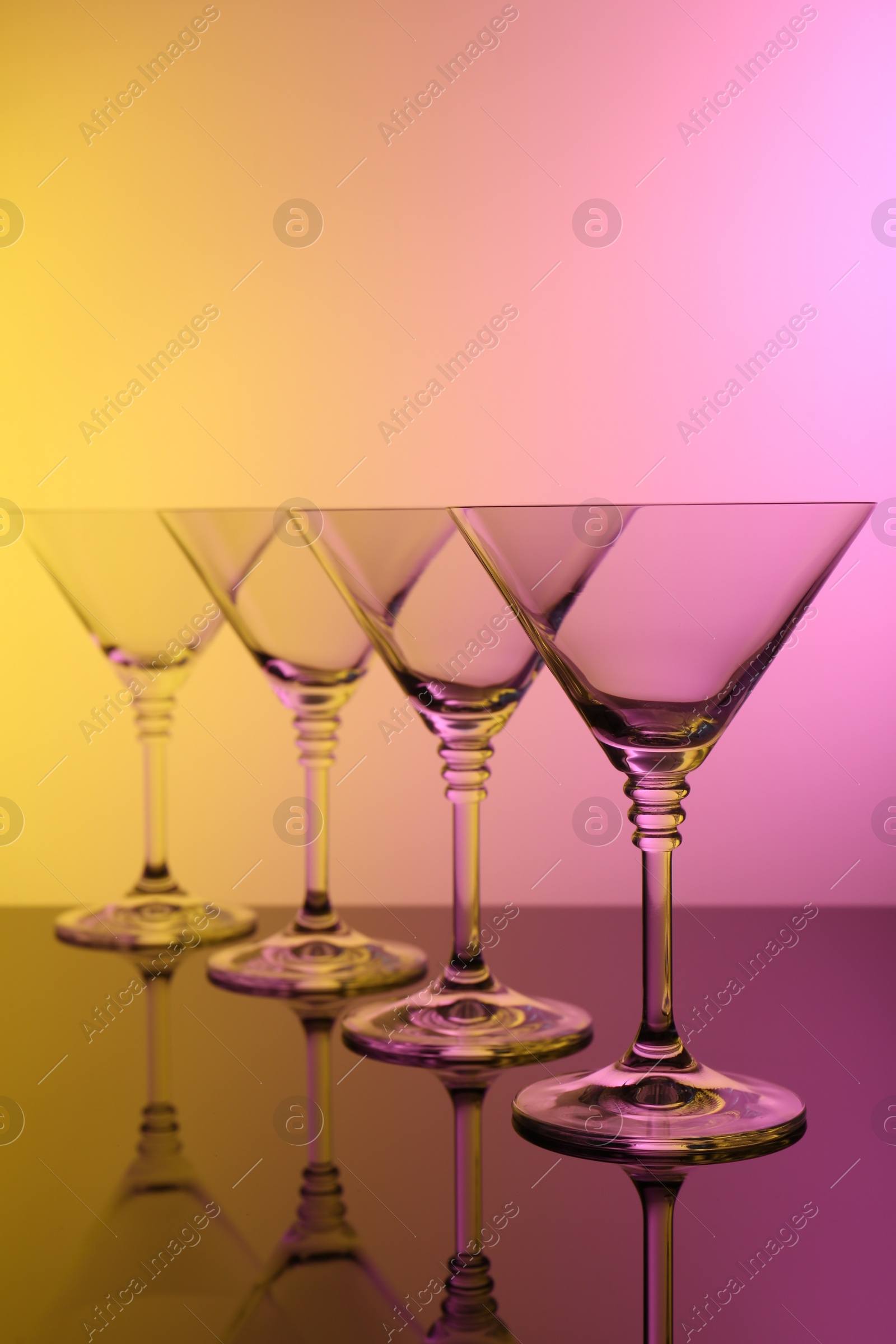 Photo of Empty glasses on table, color tone effect