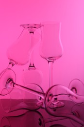 Photo of Empty glasses on table, color tone effect