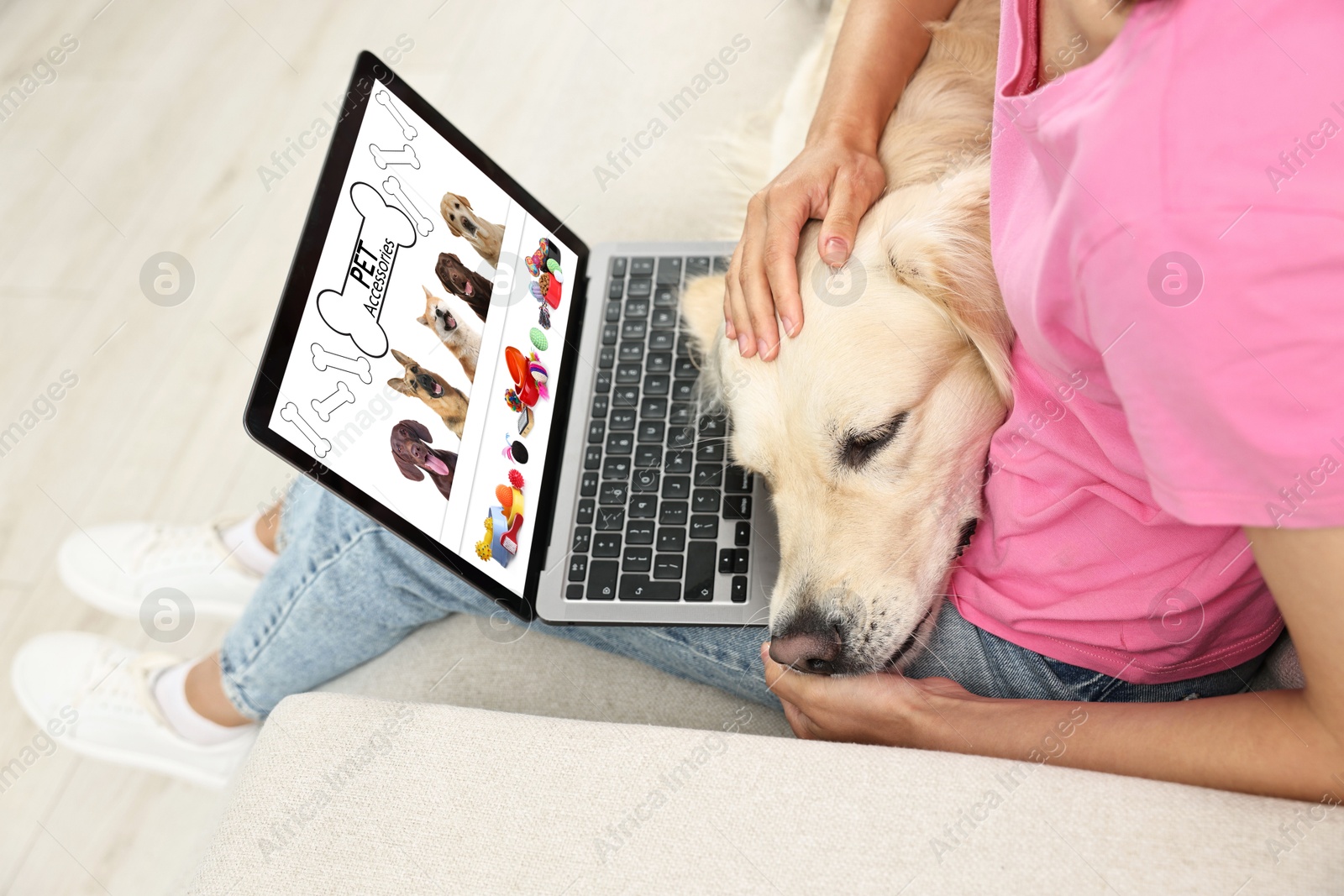 Image of Woman with her cute dog shopping online on laptop at home, closeup. Computer with open pet shop website