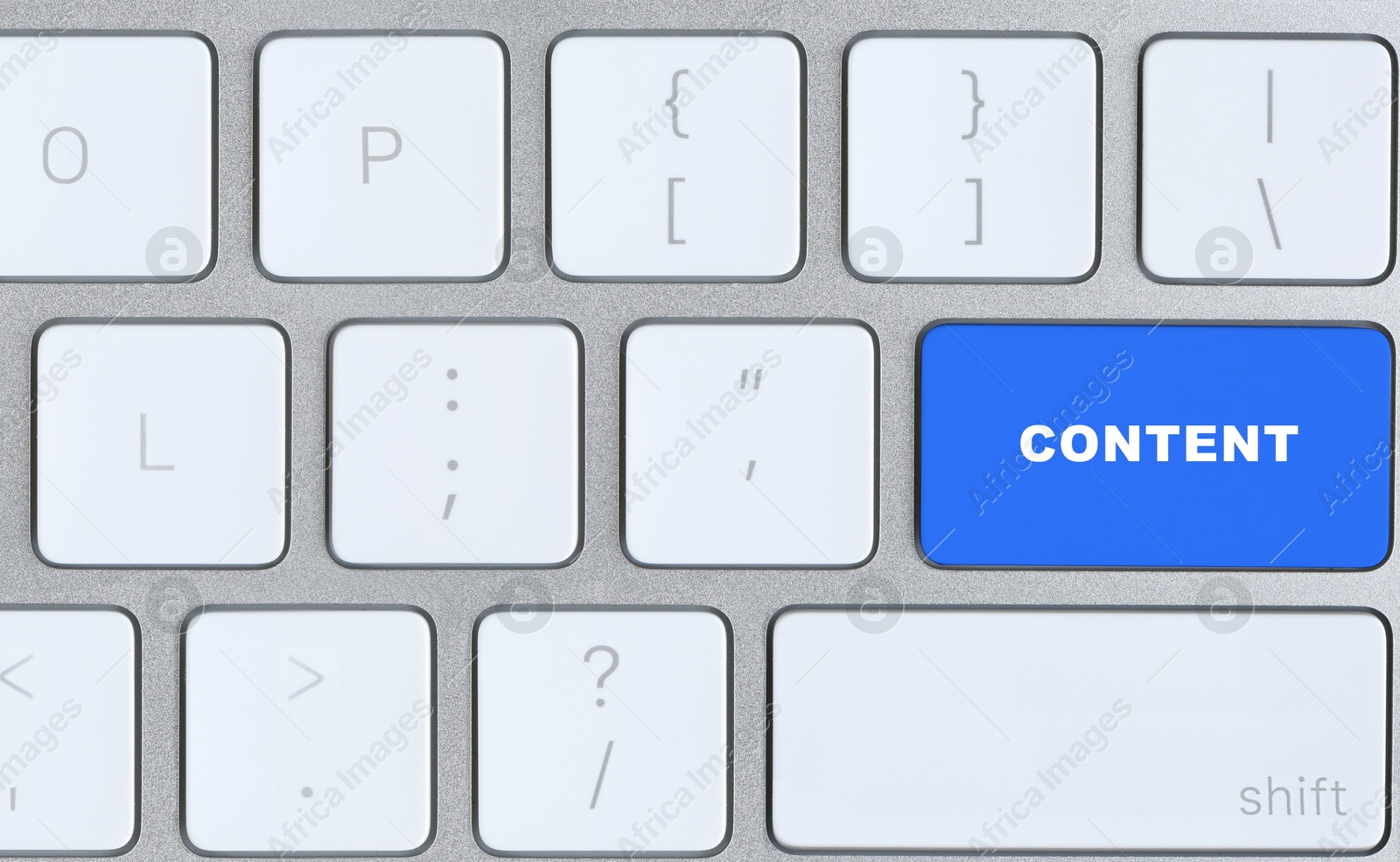 Image of Computer keyboard with word Content on blue button, closeup