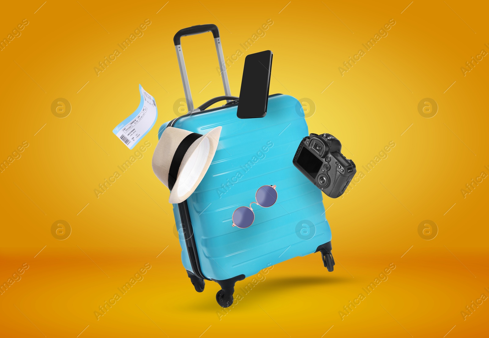 Image of Suitcase, ticket, smartphone, sunglasses, hat and camera in air on orange background. Ready to travel