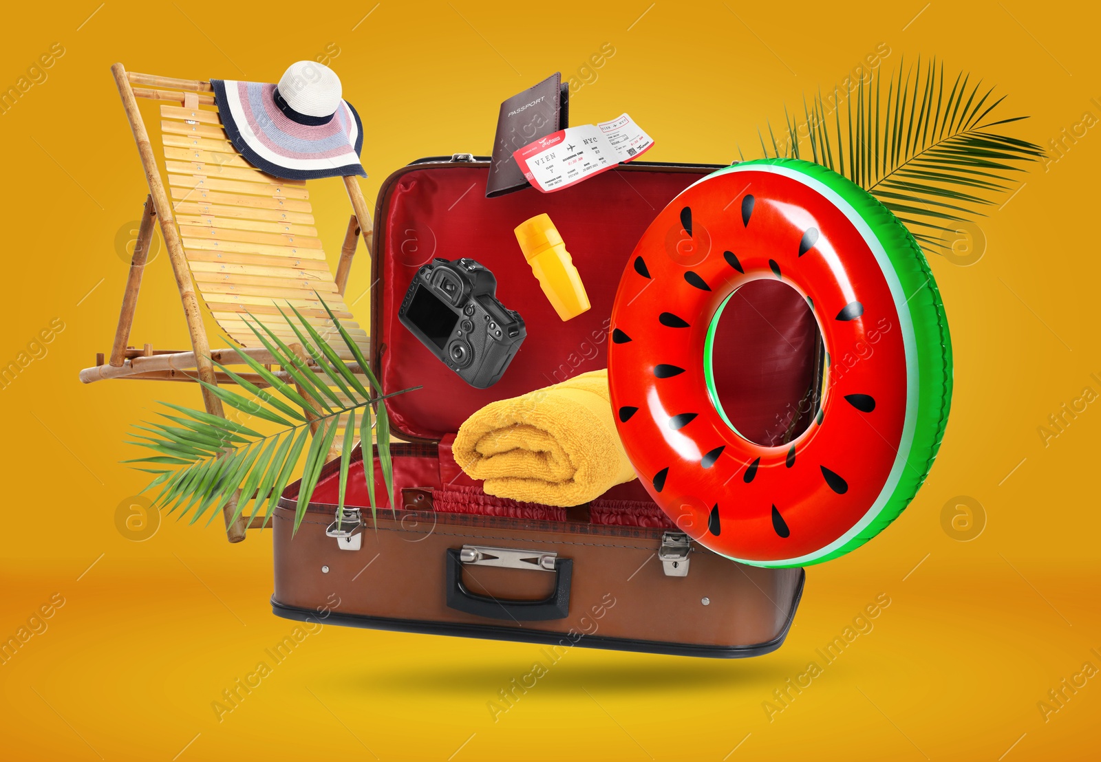 Image of Suitcase and beach items in air on orange background. Ready to travel