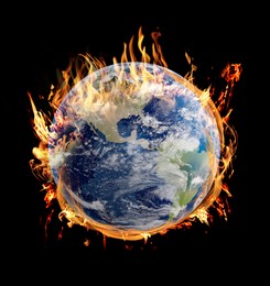 Image of Planet Earth on fire against black background. Conceptual image for global warming. Image elements furnished by NASA