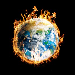 Image of Planet Earth on fire against black background. Conceptual image for global warming. Image elements furnished by NASA