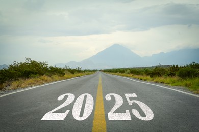 Image of 2025 on asphalt road. Concept of new year, fresh beginning