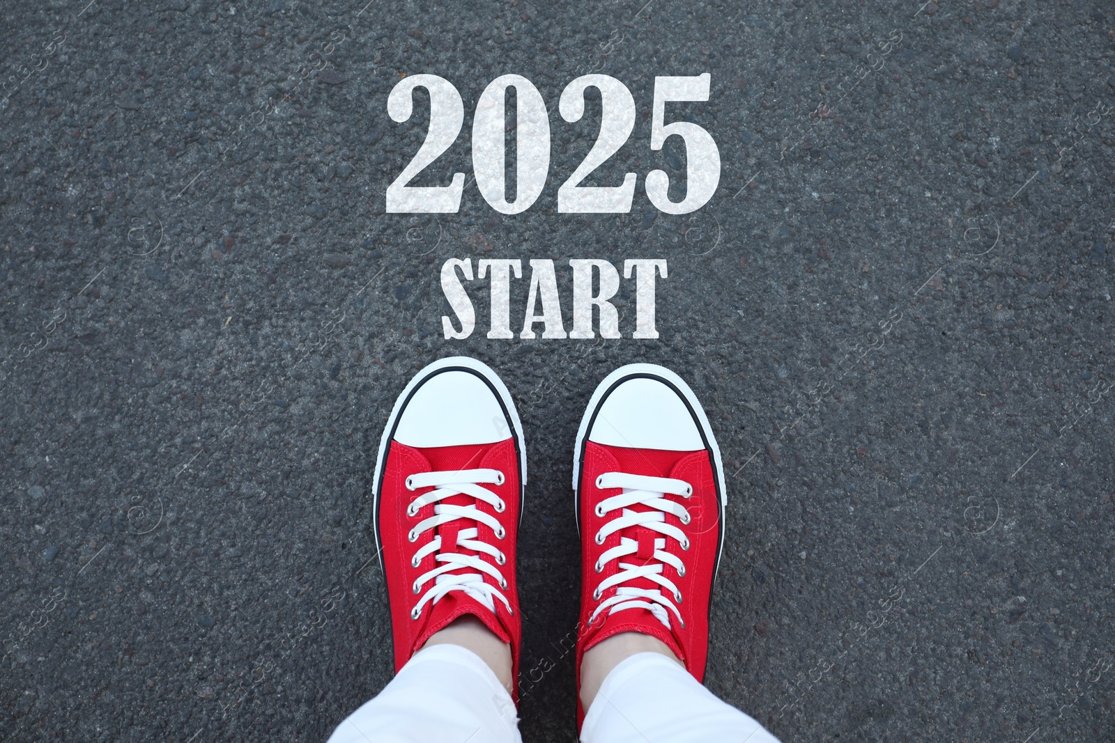 Image of Woman standing near sign 2025 Start on asphalt, top view. Concept of new year, fresh beginning