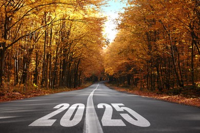 2025 on asphalt road. Concept of new year, fresh beginning