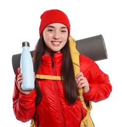 Photo of Smiling young woman with backpack and thermo bottle on white background. Active tourism