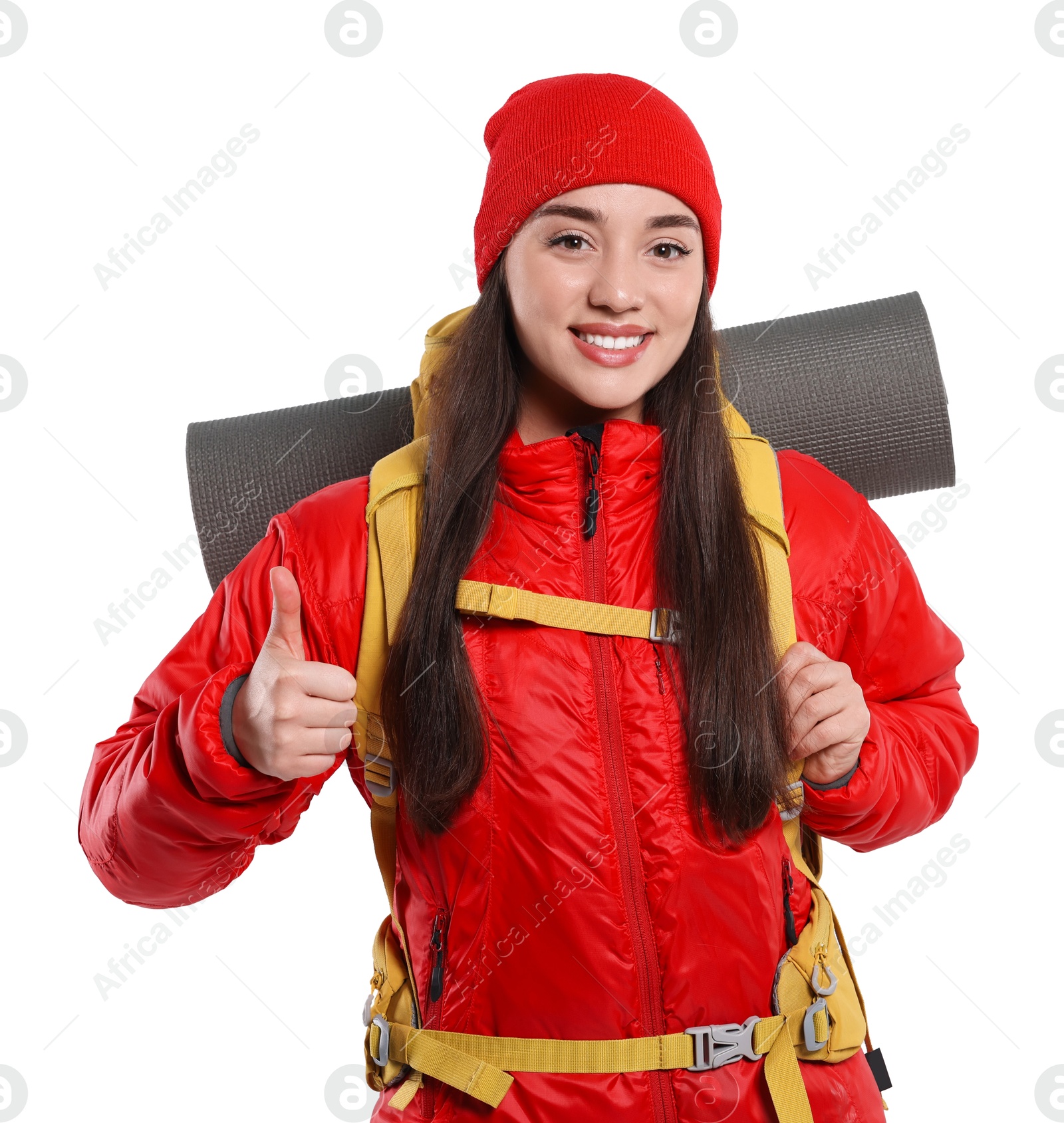 Photo of Smiling young woman with backpack showing thumb up on white background. Active tourism