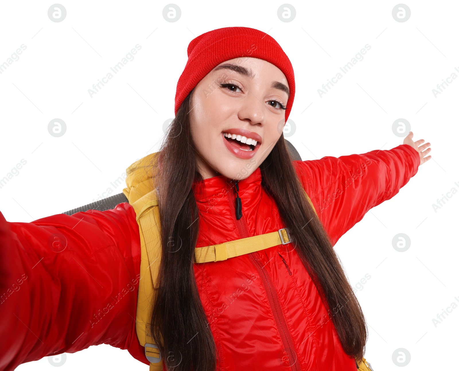 Photo of Smiling young woman with backpack taking selfie on white background. Active tourism