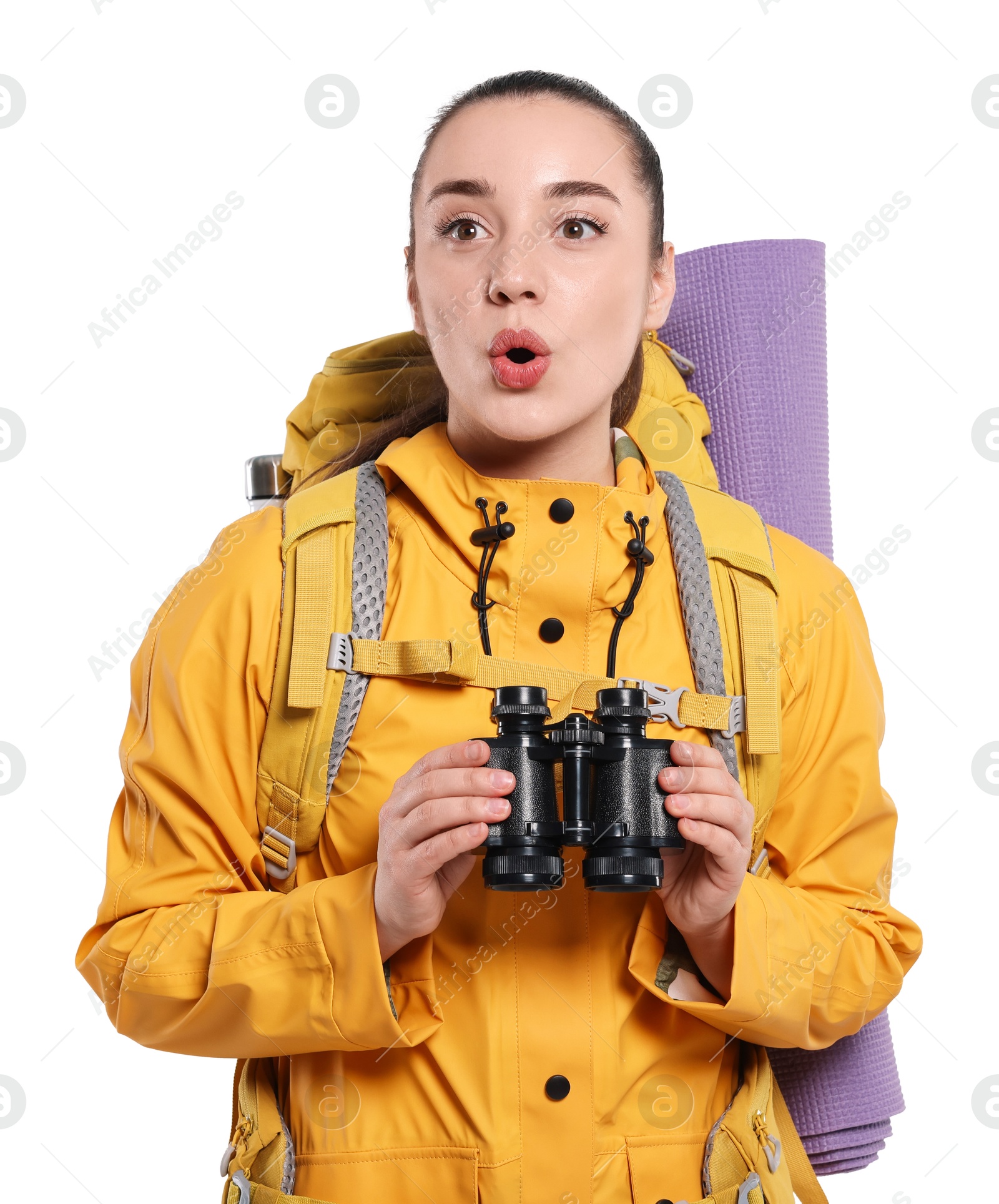 Photo of Emotional young woman with backpack and binoculars on white background. Active tourism