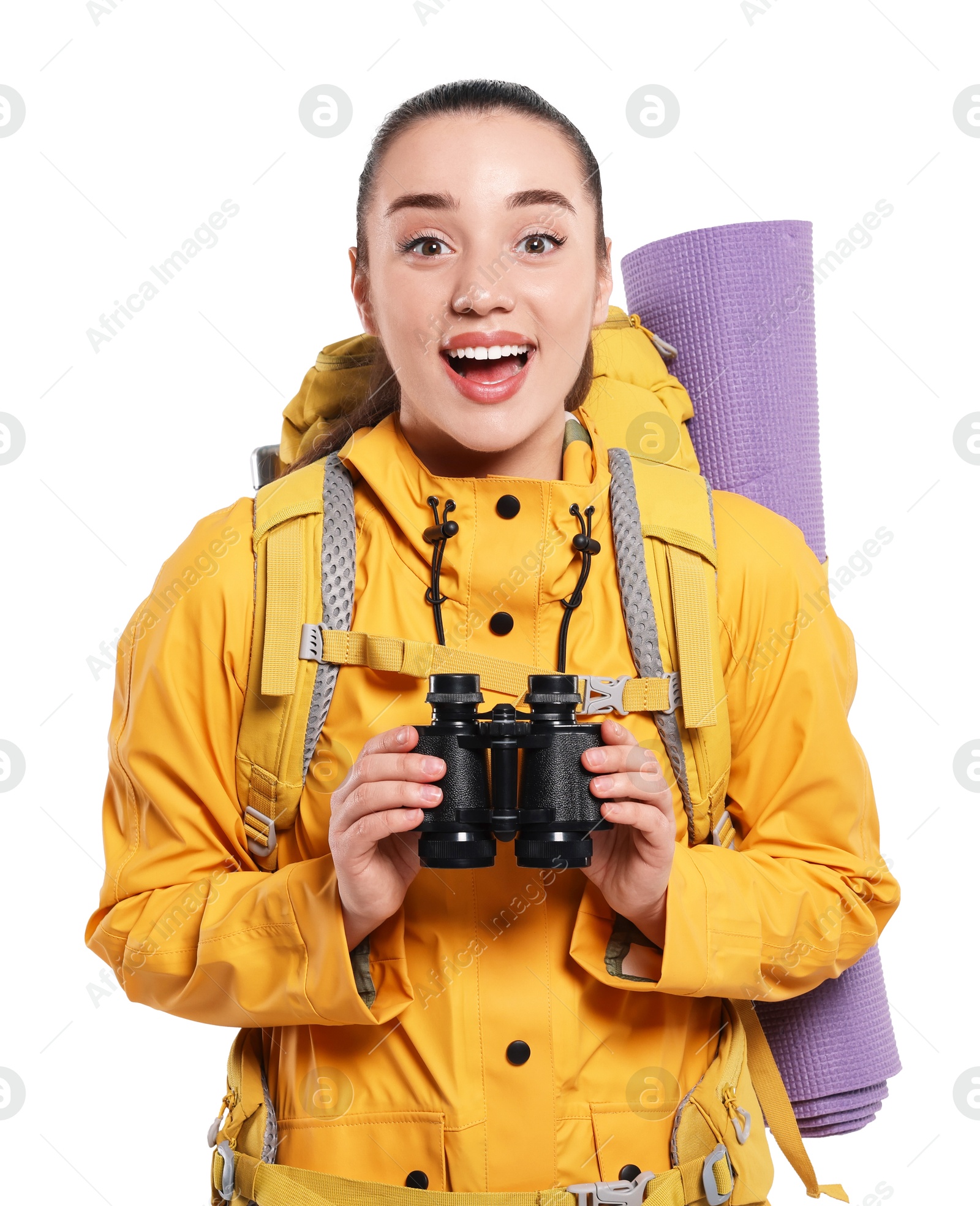 Photo of Emotional young woman with backpack and binoculars on white background. Active tourism