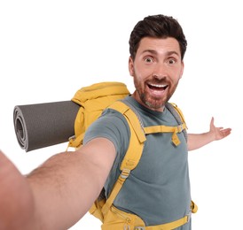 Happy man with backpack taking selfie on white background. Active tourism