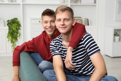 Family portrait of happy brothers at home