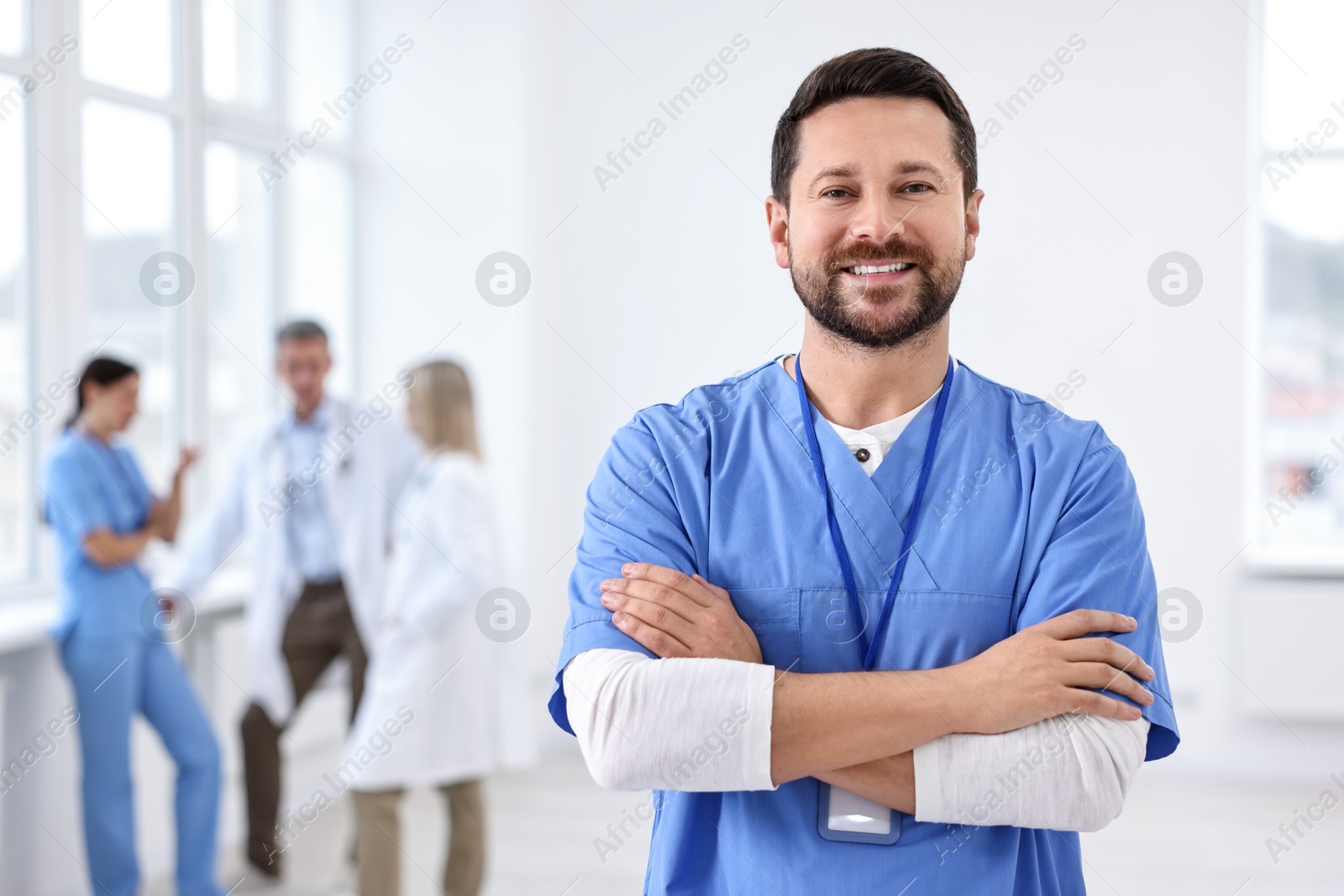 Photo of Healthcare workers in hospital, selective focus. Portrait of smiling nurse indoors