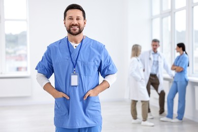 Photo of Healthcare workers in hospital, selective focus. Portrait of smiling nurse indoors